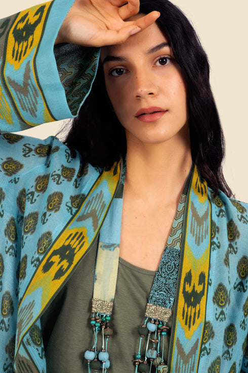 Coat in cotton gauze with asymmetric hemline